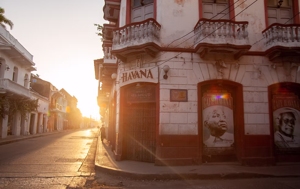 Historic red and white building during sunrise