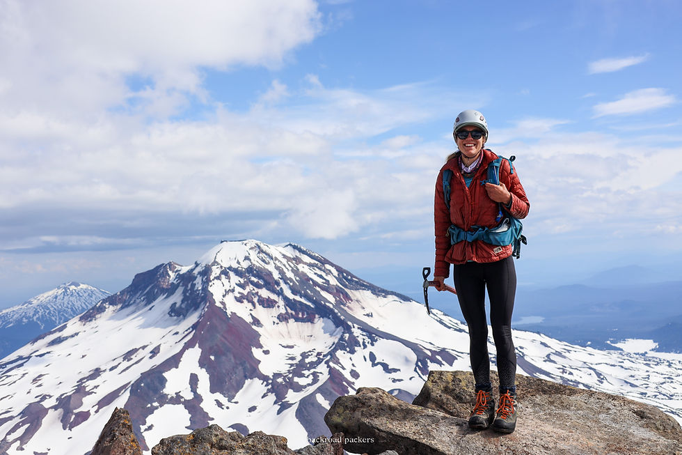 Mountaineerer on summit of Middle Sister Mountain in Oregon
