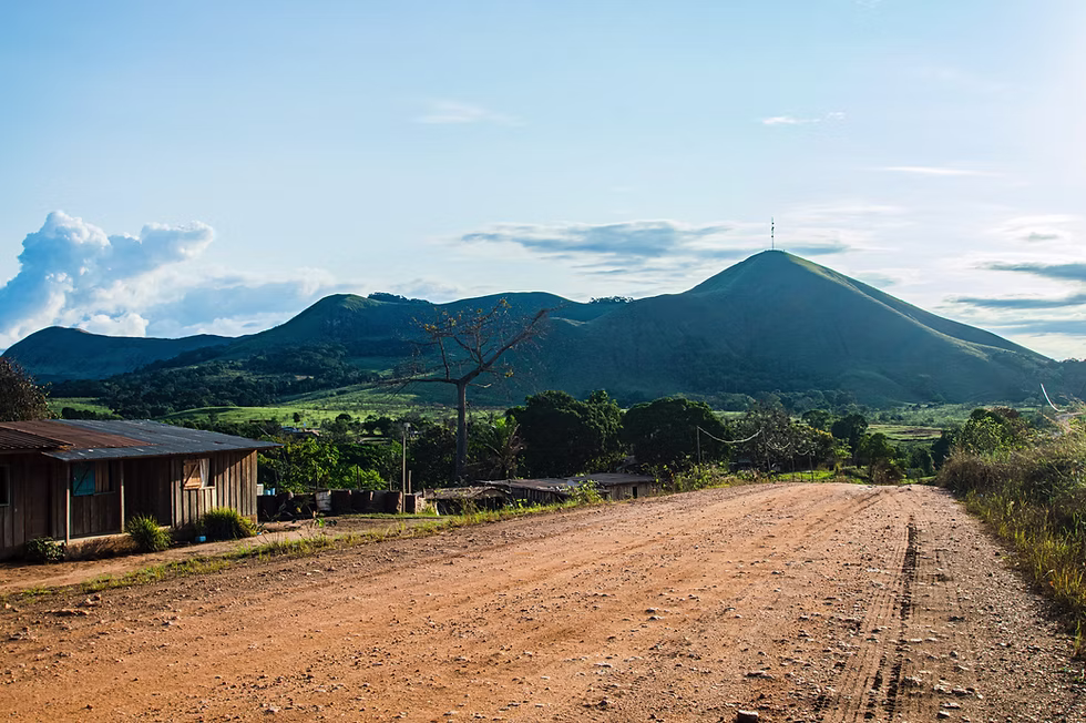 Red dirt road through the Gabon countryside.